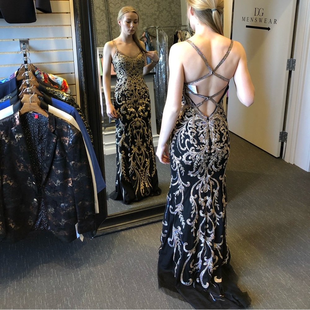 Morilee by Madeline Gardner. Black and Gold detailed dress.